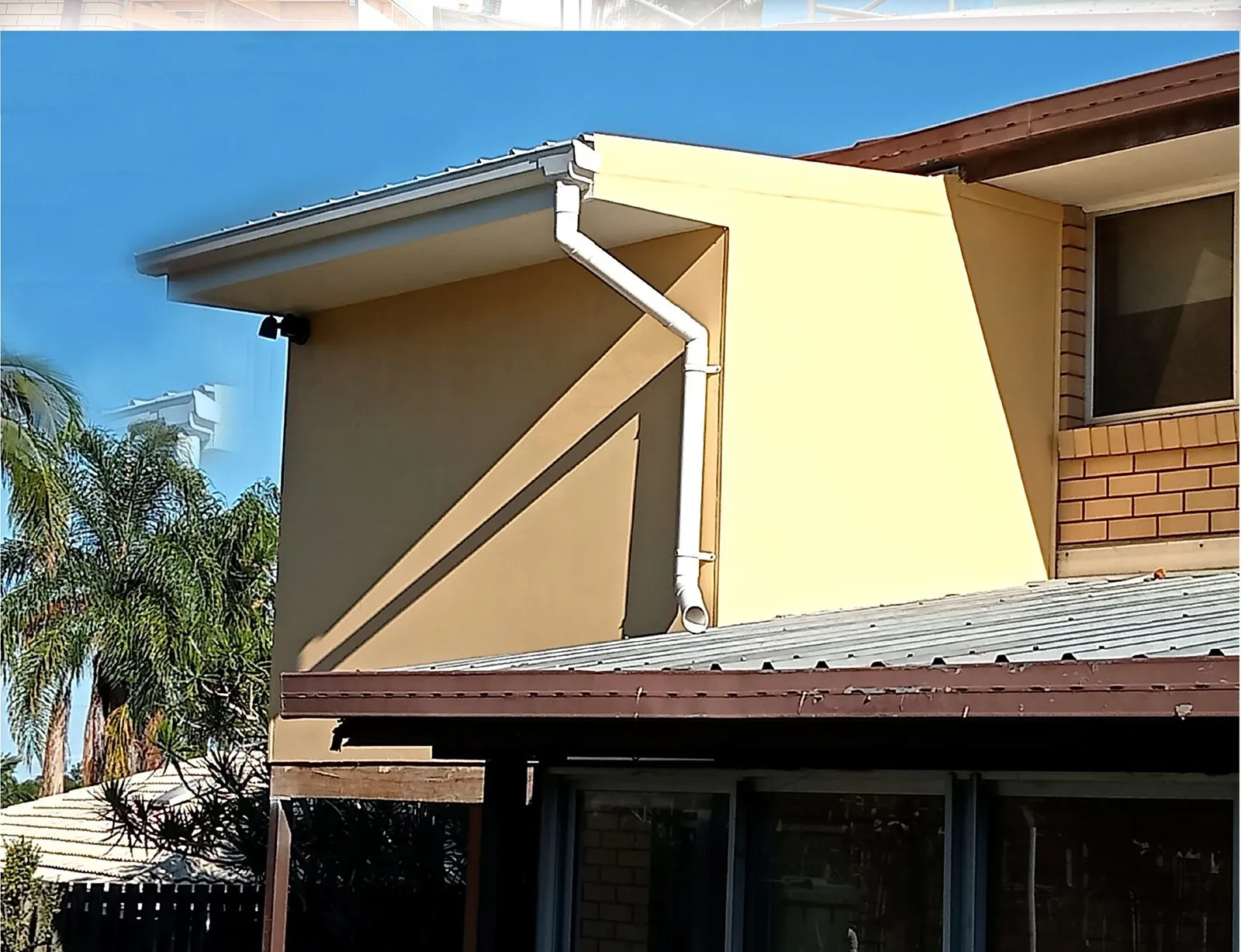 Completed rendered home extension blending with existing house - Gold Coast