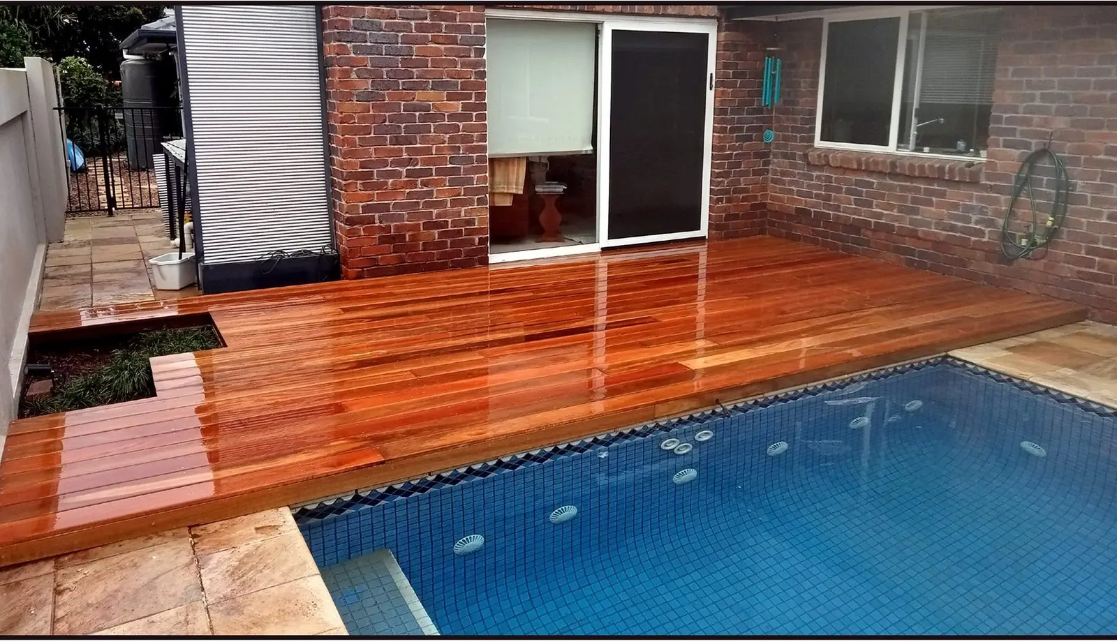 Premium pool deck installation Gold Coast - hardwood decking and outdoor entertaining area